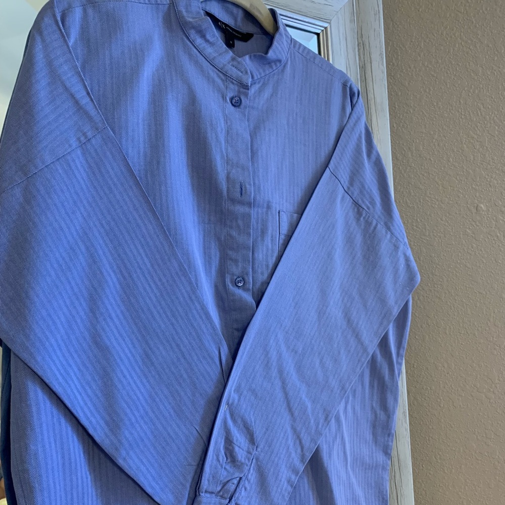 LIGHT BLUE LONG SLEEVE ARMANI EXCHANGE BUTTON DOWN. DRY CLEANED